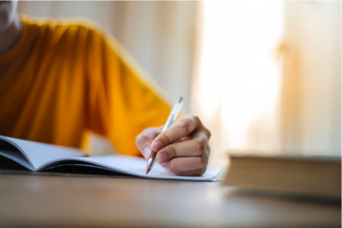 stock photo of a student writing